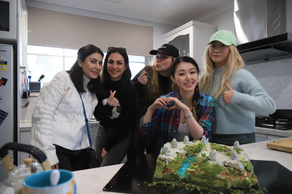 Landscape architects together with the cake created for a design competition.